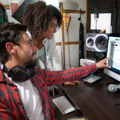 Two people in a recording studio